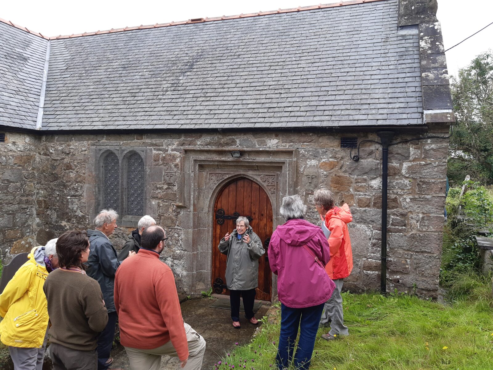 Anglesey Antiquarian Society members visiting Llanbedrgoch church